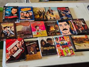 DVD and CD collection including Magnum P.I., Seinfeld, Tin Man, Burn Notice, Batman, and more