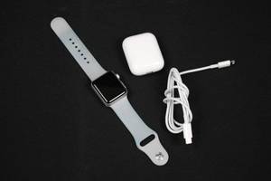 Apple Watch with Light Gray Sport Band, AirPods Case & USB Charging Cable (Watch not tested)