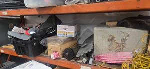 Contents of the First Pallet Rack ( it includes a heavy-duty safe that we cant figure our tge combination  and assorted Contents which includes two treadmills motors)