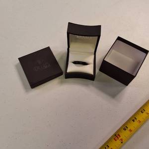 Wedding band presented in its original packaging from Riddles Jewelry
