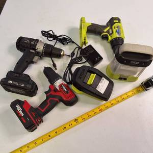 Lot includes a Ryobi 18V ONE HP brushless drill, a Ryobi 18V ONE work light, a Hyper Tough 20V drill, batteries & charger