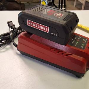 Craftsman V20 2.5 Ah Lithium-Ion Battery (CMCB202) on a compatible Craftsman V20 Battery Charger