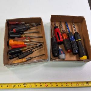 collection of assorted screwdrivers and hand tools from brands such as Craftsman and Klein Tools