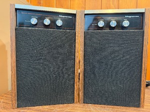Both power on- Pair of This is a vintage Magnavox remote receiver speaker. It features control knobs for loudness, treble, and bass.