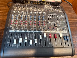 Powers on  Mackie DFX-12, a 12-channel integrated live sound mixer