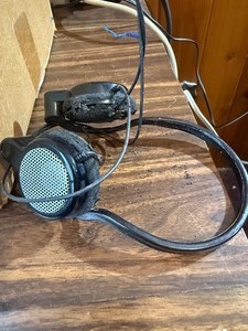 Grado iGrado behind-the-neck stereo headphones And assortment of wires and plugs.