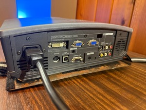 Powers on , illuminates -Mitsubishi HC1100 DLP Projector, designed for home theater use.