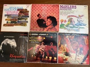 This collection of vintage RCA Victor vinyl records features classical music and big band performances from the mid-20th century.