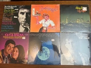 Unopened -collection of vintage vinyl records featuring artists like Burt Bacharach, Lawrence Welk, and Bert Kaempfert.