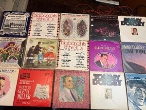 Vintage big band and jazz LP collection featuring well-known artists including Glenn Miller, Jimmy Dorsey, Buddy Morrow, and Tommy Dorsey, along with multiple Big Band Hits of the 30s