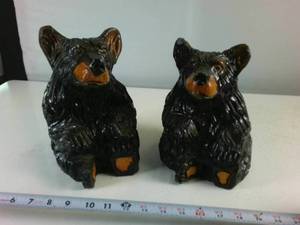 Two hand carved sitting black bears painted with gloss finish