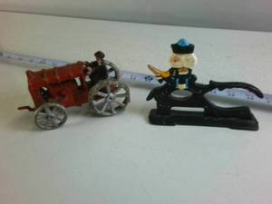 Lot of (2) Cast Iron Collectibles Farmer on Tractor and Nutcracker