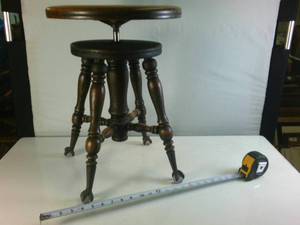 Antique Adjustable Stool made of hardwood with clawfeet