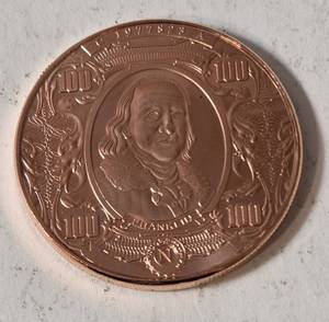 1 AVDP Oz. Copper Bullion Round designed to look like a US $100 banknote featuring Benjamin Franklin. Material 99.9% pure solid copper -BU