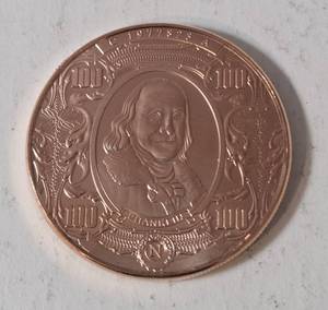 1 AVDP Oz. Copper Bullion Round designed to look like a US $100 banknote featuring Benjamin Franklin. Material 99.9% pure solid copper - BU