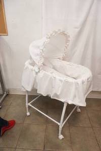 White Bassinet. In Good Condition. On Wheels