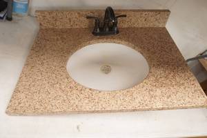 Bathroom Sink with granite  top and Faucet, good condtion , 31 x22.5