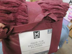 2 Faux fur decorative pillows...