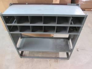 Metal shop shelf with storage cubbi...
