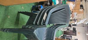 Lot of 4 green durable plastic chairs ( USED)