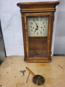 Howard Miller Clock 613-108 Oak Wall Clock with Pendulum & Winding Key