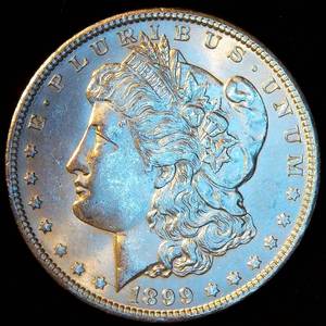 AU 1899-O Morgan Silver Dollar, possibly dipped but otherwise a nice coin wlimited wear