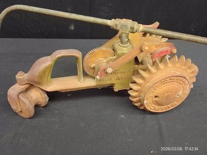 VINTAGE NATIONAL WALKING LAWN SPRINKLER AND WHEELS