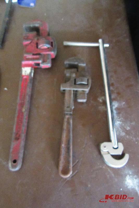 lot 99 image: Pipe wrenches and basin wrench, C clamps