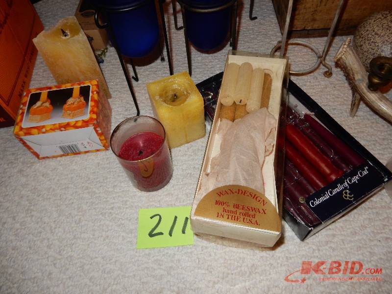 lot 211 image: Candles and candle holders.. 3 pottery eggs..(1 cracked in 12 but could be glued.. Perfect break). 1 old Box