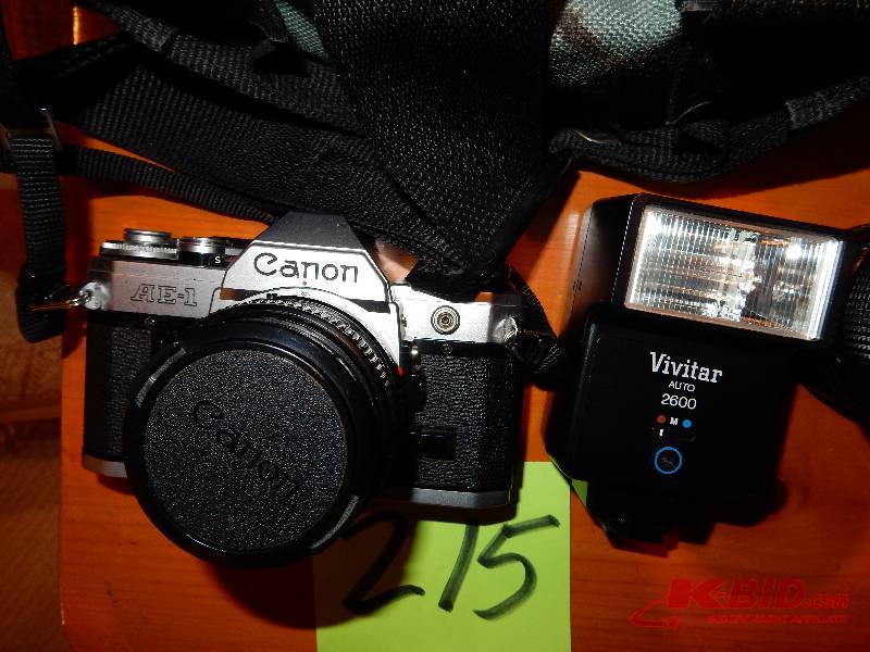 lot 215 image: Canon AE1 35MM camera, flash and lense