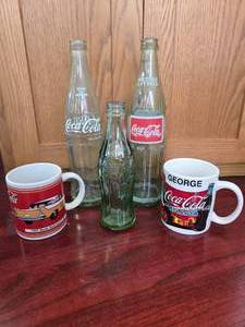 3 Coke Bottles, 2 Coke Mugs George