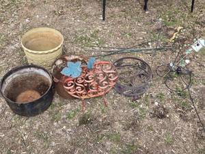 Lot of Garden Decor and Planters including Metal Buckets, Decorative Stakes, and Metal Pumpkin