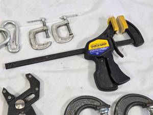 Assorted Hand Tools including Craftsman RoboGrip Pliers, C-Clamps, and Quick-Grip Clamp