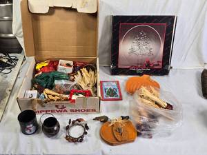 Box of Holiday Decorations with Crystal Party Plate, Corn Decorations, and Santa Figurine