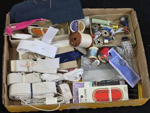 Box of Sewing Supplies including Threads, Bobbins, and Needles, Elastic Bands, and Lace Trim