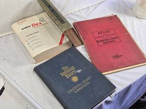Collection of Books including The Centennial History of Kandiyohi County Minnesota, Atlas and Farmers Directory of Kandiyohi County Minnesota, Birds of America, and USWEST Dex Minneapolis Directory