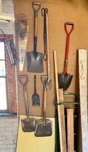 Contents of Wall - Shovels, Saw &amp 2-Wheel Dolly