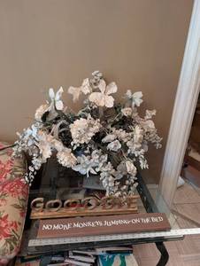 Decorative Floral Arrangement in Clear Crystal Vase and two decorative signs