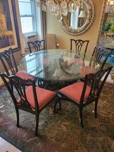 Beautifully Carved Wooden Dining Table with Winged Lion Base and Round Glass Top