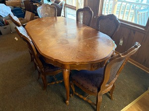 Dining room table with padded chairs