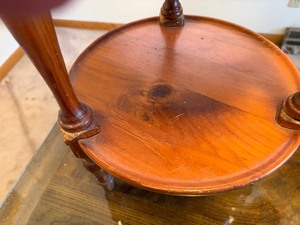 Round wooden shelving with decorative posts