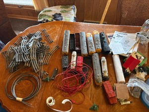 Large assortment of old model trains, tracks, and accessories