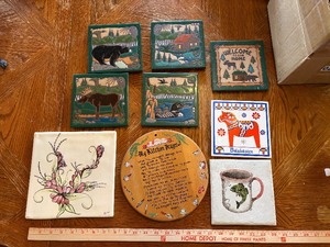 Rustic ceramic tile trivets of wildlife and cabin scenes