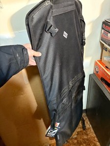 Closet hanging gun rack. Holds two guns.  Brand new