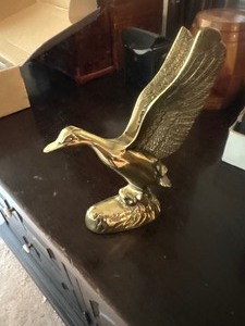 Brass flying duck statue