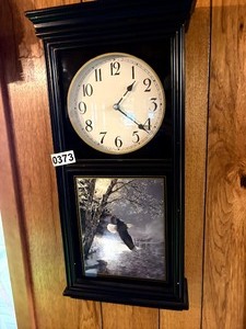 Wall clock with eagle depiction