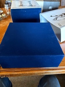 New in box silver platted gravy bowl and candlesticks