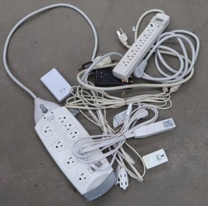 LOT OF EXTENSION CORDS AND SURGE PROTECTERS