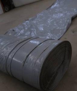 BIG ROLL OF HEAVY DUTY GRAY LAY FLAT TUBING