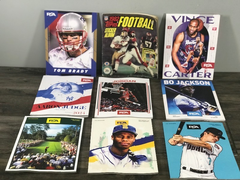 8 - Collectible PSA Magazines and 1 - 1982 Topps Football Sticker Album with Stickers in it